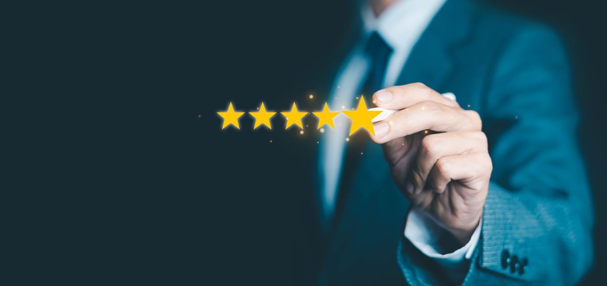 Insurance agent explaining a policy to a smiling client across a desk