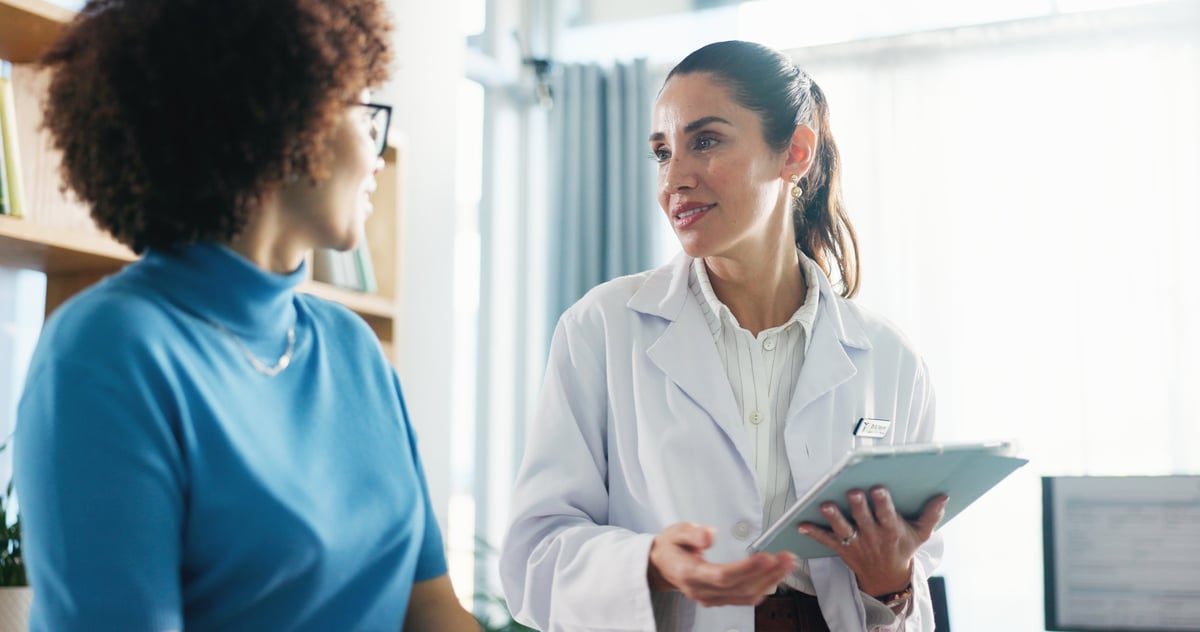 Medical provider consulting with a patient